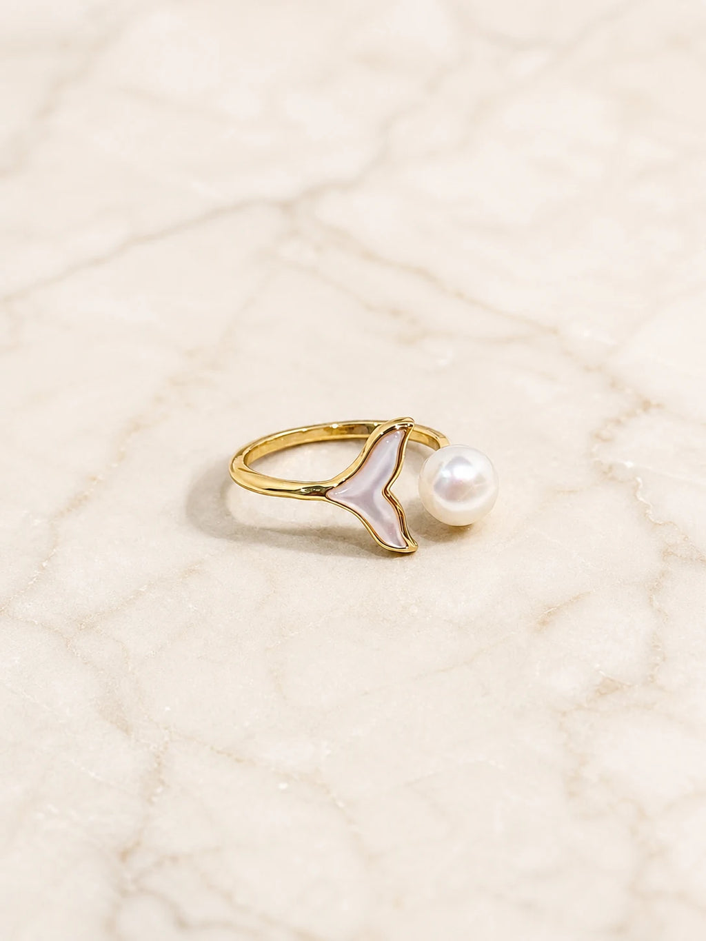 Close-up of mermaid pearl ring in Gold-plated brass.