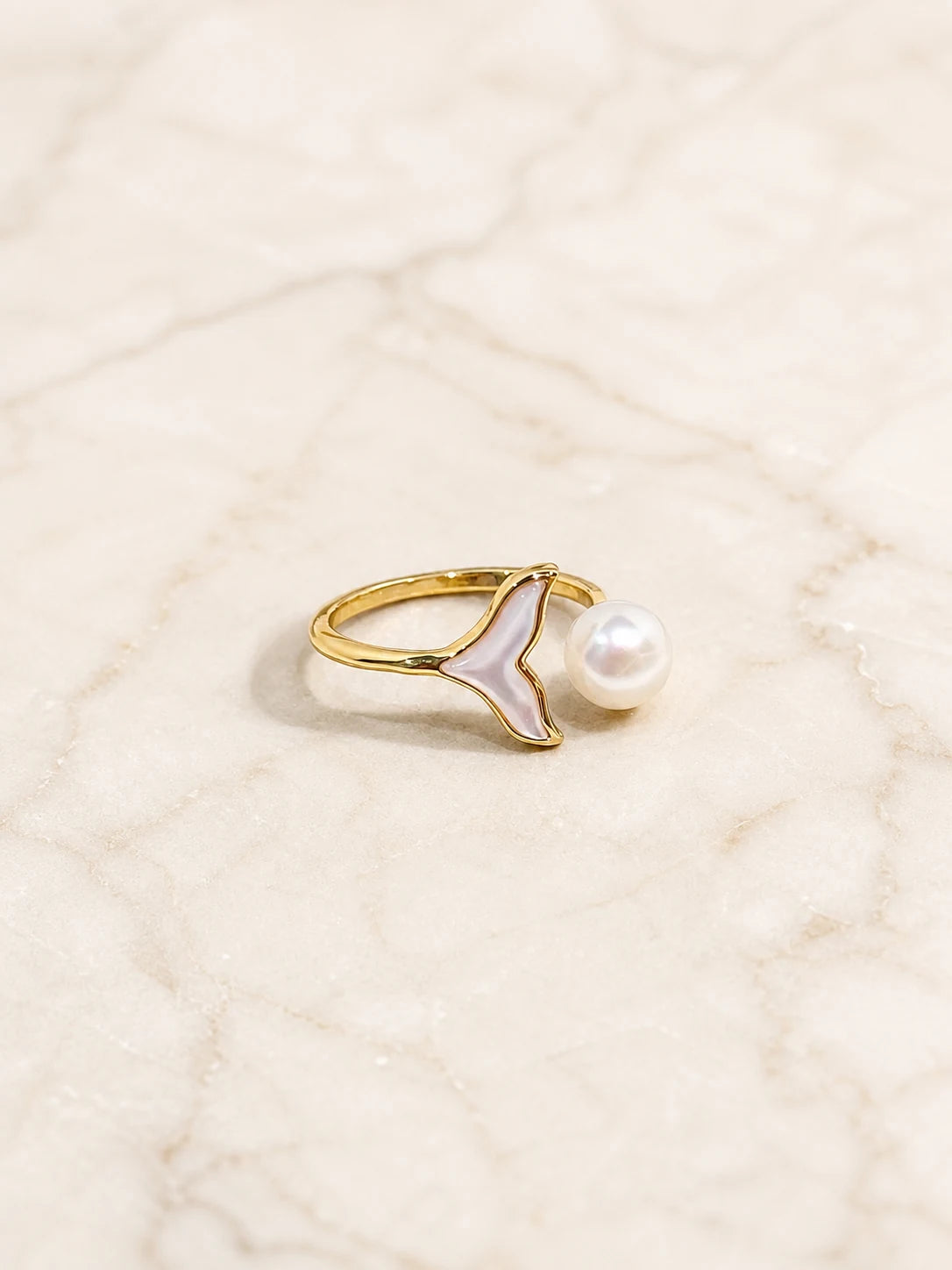 Close-up of mermaid pearl ring in Gold-plated brass.