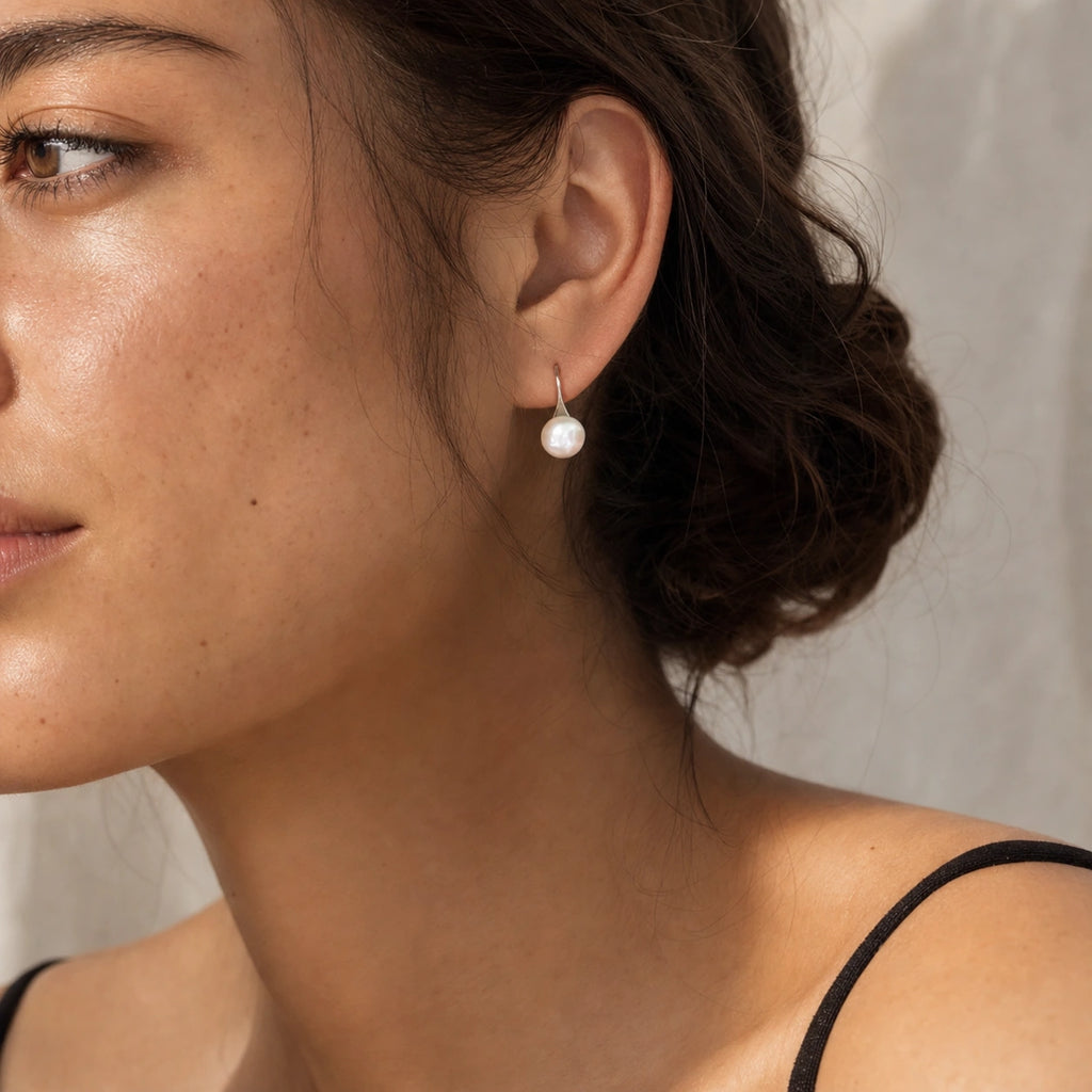 Freshwater pearl hook earrings in silver model close-up view