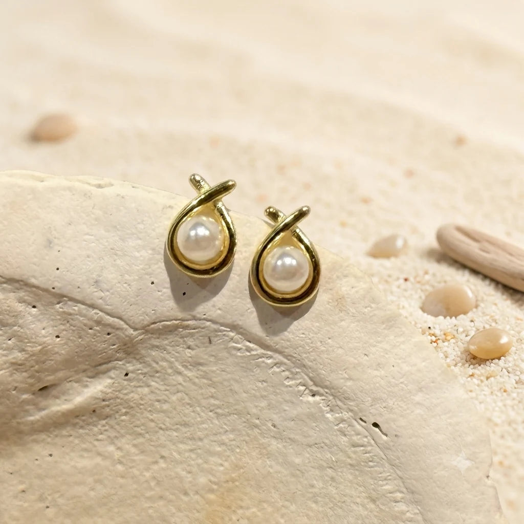 Pearl Circle Stud Earrings in Gold-plated brass with 925 sterling silver posts displayed in a product styling scene.
