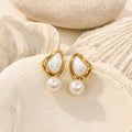 Triangle Pearl Stud Earrings in 14k gold-plated brass with 925 sterling silver posts displayed in a product styling scene.