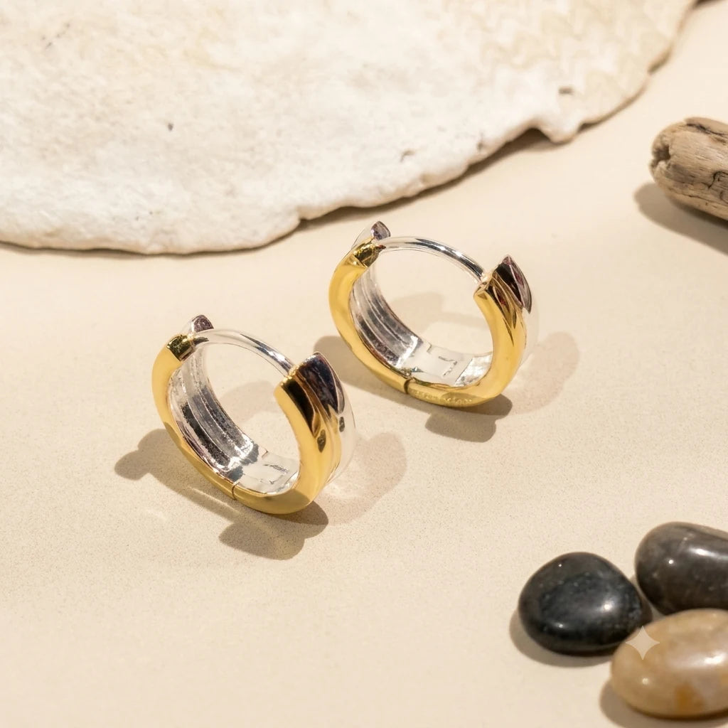 Close-up of two-tone hoop earrings in Gold-plated 925 sterling silver.