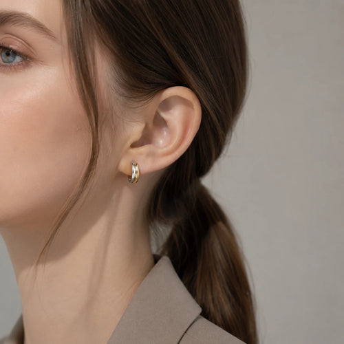 Close-up of two-tone hoop earrings in Gold-plated 925 sterling silver.